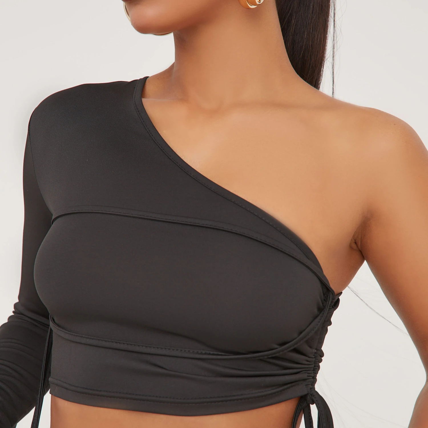 EGO One Sleeve Ruched Wrap Detail Crop Top In Black Slinky 4 EGO One Sleeve Ruched Wrap Detail Crop Top In Black Slinky - Image 2
