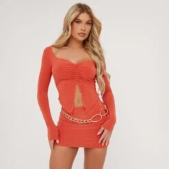 EGO Long Sleeve Ruched Detail Split Front Crop Top In Orange Slinky